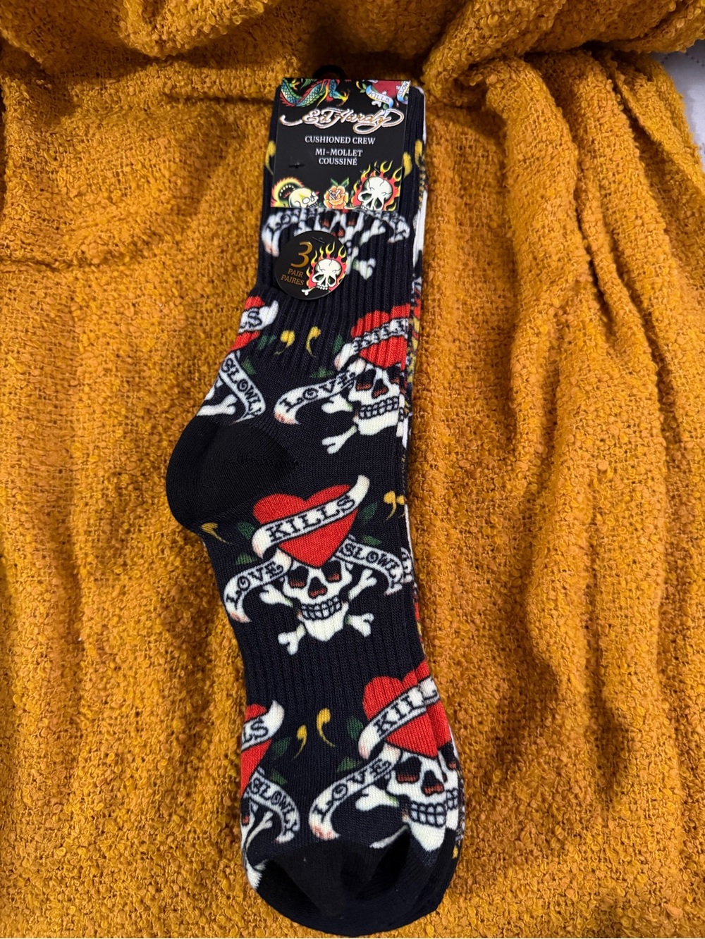 Ed Hardy cushioned crew socks feature the brand's signature "Love Kills Slowly"